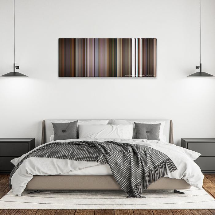 Little Nicky color palette canvas above a bed, between two black pendant lamps