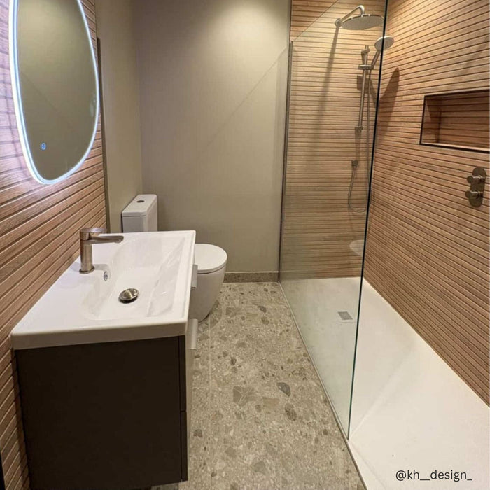 Modern bathroom with ridged wood effect wall tiles and terrazzo effect floor tiles and wall hung vanity unit