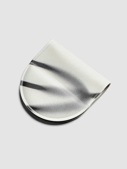 Magnetic Bookmark | Pen Holder | Vinyl in Blurred Line, angled view showing white base with sweeping dark gray brushstroke pattern