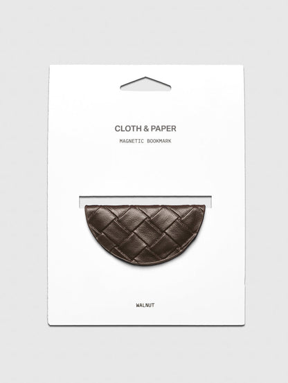 Woven vegan leather magnetic bookmark in the color walnut shown on a backing card.