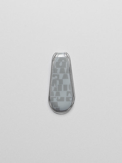 Blue patterned magnetic bookmark shown closed, laying flat on a neutral background.