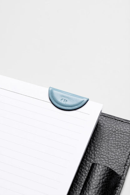 Mini Magnetic Bookmark in the color Smoked Salt attached to the inside of a planner.