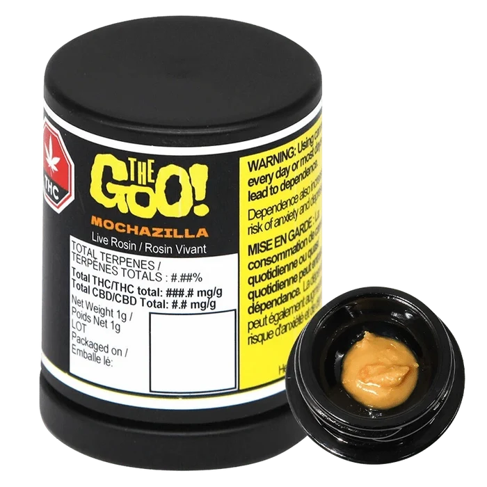Angled studio shot of a black jar labeled "Mochazilla Live Rosin" with a small open container showing tan, glossy concentrate.