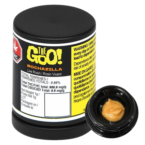 Angled studio shot of a black jar labeled "Mochazilla Live Rosin" with a small open container showing tan, glossy concentrate.