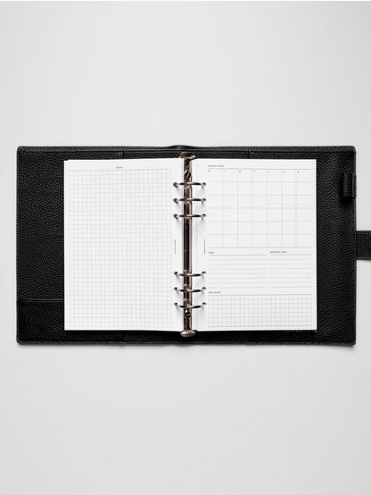 Insert in use inside a black leather planner.