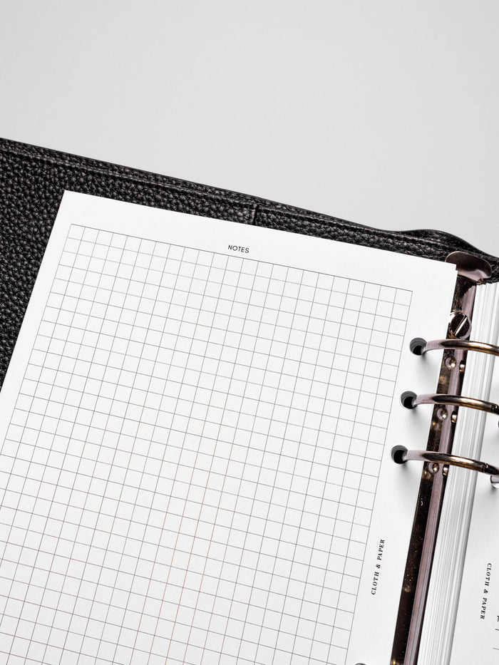 Insert in use inside a black leather planner.