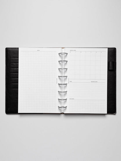 Insert in use inside a black leather planner.