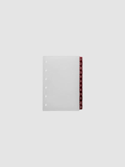 Pocket 6-Ring Punch Ultra-Thin Monthly Dividers in deep red, set of 12 dividers fanned to show all months