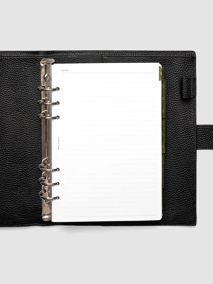 A5 6-Ring Punch Ultra-Thin Monthly Dividers in olive green shown tabbed inside a planner