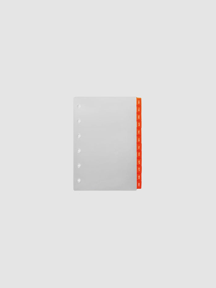 Pocket 6-Ring Punch Ultra-Thin Monthly Dividers in deep orange, set of 12 dividers fanned to show all months