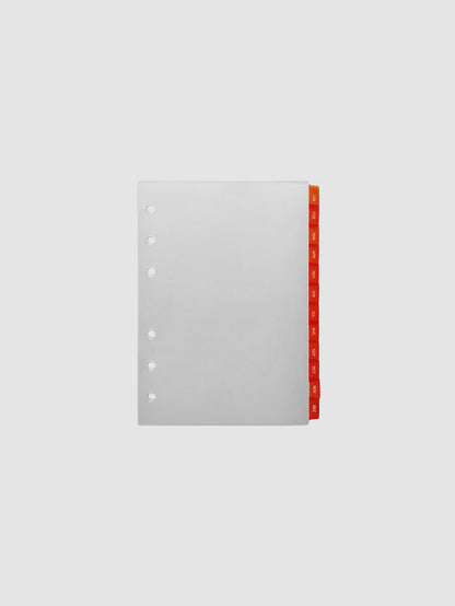 A6 6-Ring Punch Ultra-Thin Monthly Dividers in deep orange, set of 12 dividers fanned to show all months