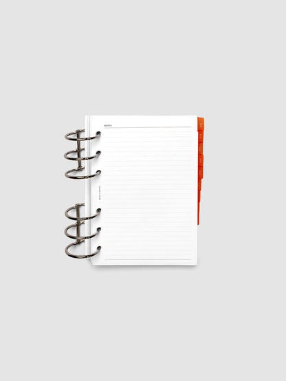 A6 6-Ring Punch Ultra-Thin Monthly Dividers in deep orange shown tabbed inside a planner