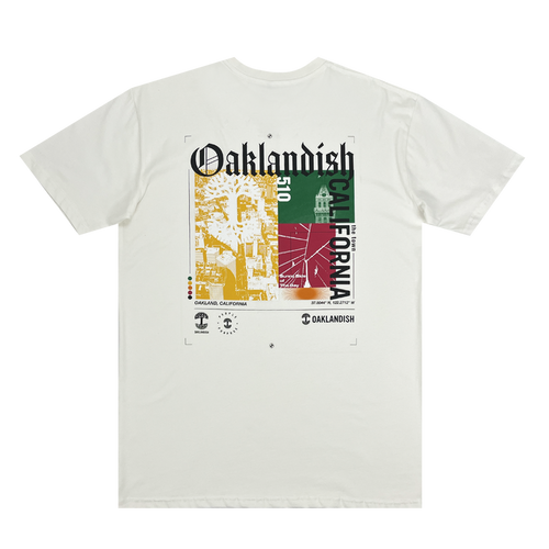 Backside view of a natural cotton-colored t-shirt with an abstract yellow, green, and red motif graphic with Oaklandish California wordmarks and logos.