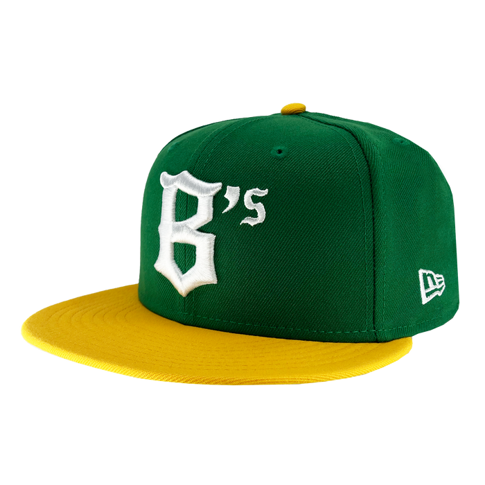 A green New Era Oakland Ballers 59Fifty Cap with a yellow brim, evocative of an Oakland sports team's colors. The front is adorned with a large white embroidered "B's" in Gothic-style font. The New Era logo is stitched on the left side, and the yellow top button matches the brim perfectly.