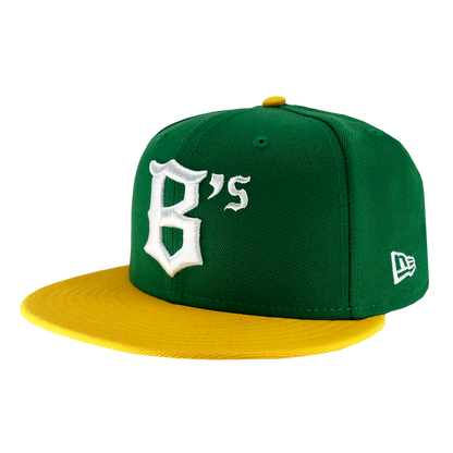 A green New Era Oakland Ballers 59Fifty Cap with a yellow brim, evocative of an Oakland sports team's colors. The front is adorned with a large white embroidered "B's" in Gothic-style font. The New Era logo is stitched on the left side, and the yellow top button matches the brim perfectly.