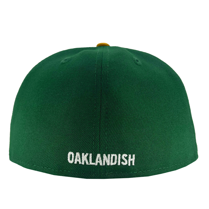 A New Era Oakland Ballers 59Fifty Cap featuring "OAKLANDISH" embroidered in white capital letters on the back. The smooth, unadorned green cap includes a partially visible button on top, making it an ideal accessory for any Oakland sports team fan.