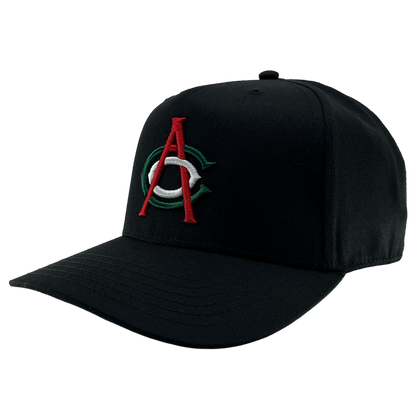The OAC Logo 5 Panel by OAC is a black snapback cap with a structured crown and curved brim, featuring an embroidered front logo of a bold red “A” layered over a green and white “C,” representing the Oakland Athletic Club. The cap is photographed against a plain white background.
