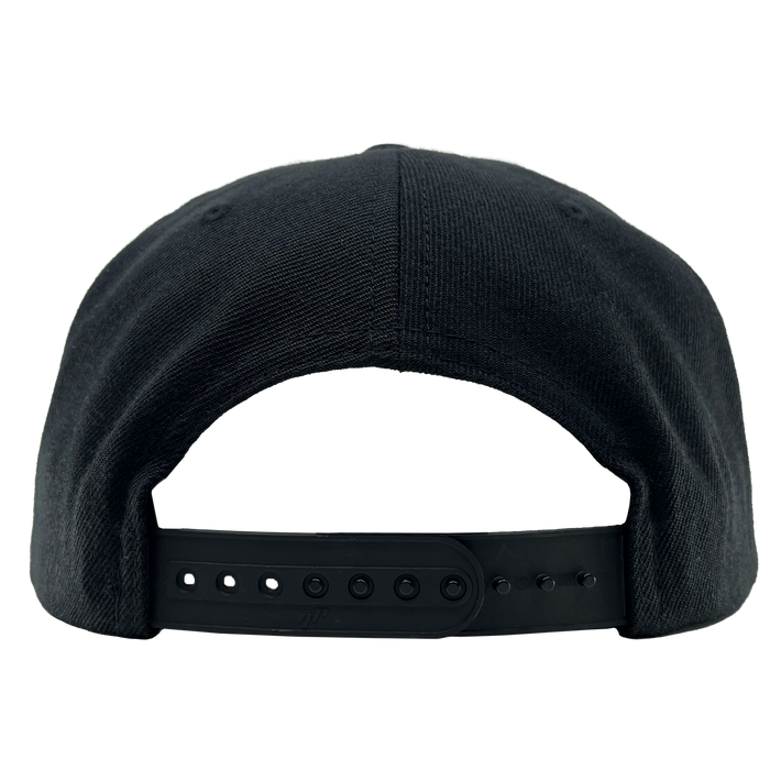 The OAC Script Snapback by OAC is displayed from the back, highlighting its plastic adjustable snapback closure with multiple holes and pegs for a customizable fit. The cap’s textured fabric adds a subtle touch of detail, making it a stylish choice—especially for fans of the Oakland Athletic Club. It rests against a plain light background.