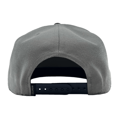 Rear view of the OAK Monogram Snapback in gray with an adjustable black snap closure. The fabric has a textured appearance, and the snap closure offers several adjustment holes. The inside of the back panel shows a partially visible sweatband. Simplistic in design, this cap features an embroidered OAK logo from Oaklandish.