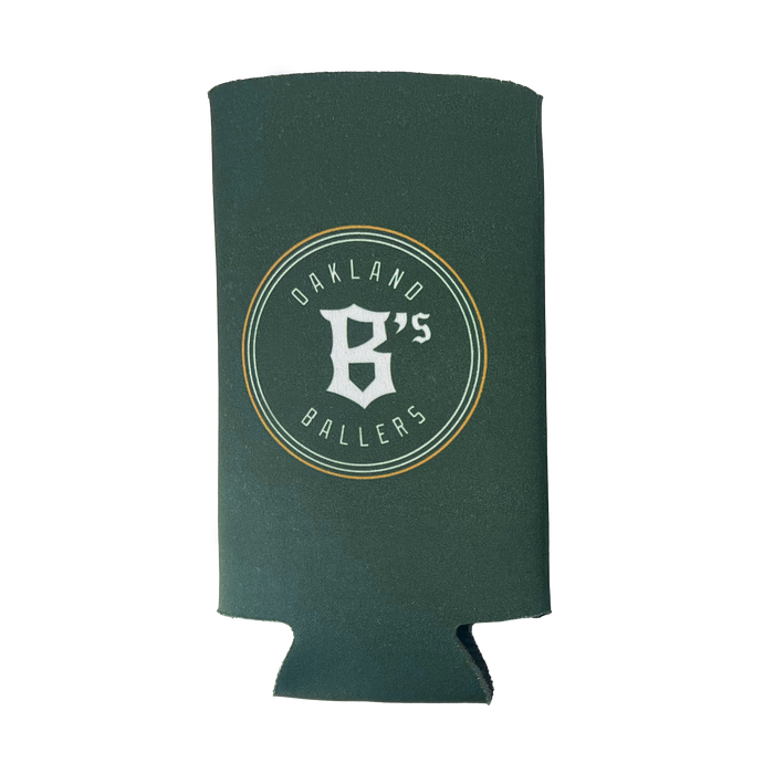 The Oakland Ballers 24oz Can Cooler features a green design with white text and a graphic. The text reads "OAKLAND BALLERS" along the outer circle and "B's" in the center, stylized with a capital "B" and an apostrophe. Representing Oakland's new pro baseball team in the Pioneer League, this cooler keeps cans cold and fresh.