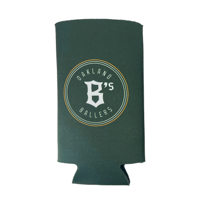 The Oakland Ballers 24oz Can Cooler features a green design with white text and a graphic. The text reads "OAKLAND BALLERS" along the outer circle and "B's" in the center, stylized with a capital "B" and an apostrophe. Representing Oakland's new pro baseball team in the Pioneer League, this cooler keeps cans cold and fresh.