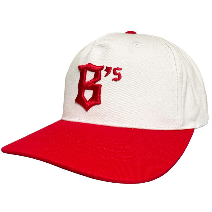 The Oakland Ballers 5 Panel Cap by Oakland Ballers features a white snapback design, red brim, and bold red embroidered "B's" on the front—perfect for any fan. The cap is displayed angled against a plain white background.
