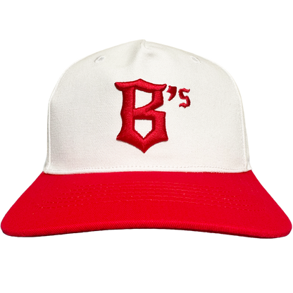 The Oakland Ballers 5 Panel Cap by Oakland Ballers is a white snapback with a red brim, featuring a large red "B" and small "'s" embroidered on the front. The background is plain light gray.
