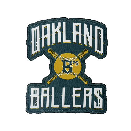 The Oakland Ballers Alt Logo Patch by Oakland Ballers features "OAKLAND BALLERS" embroidered in white with a black outline, surrounding a yellow baseball illustration crossed by two yellow bats. The baseball displays the letter "B's" in black, symbolizing the West Coast franchise, all set against a dark green background.