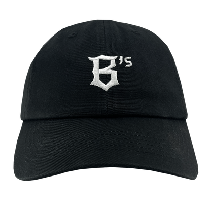 The Oakland Ballers Dad Hat, offered by the Oakland Ballers team, is a black baseball cap that prominently displays the white embroidered text "B's" on the front. Representing the new professional baseball team, this cap features a curved brim and an adjustable back strap for a casual style. The bold, slightly ornate font adds a distinctive touch to the design.