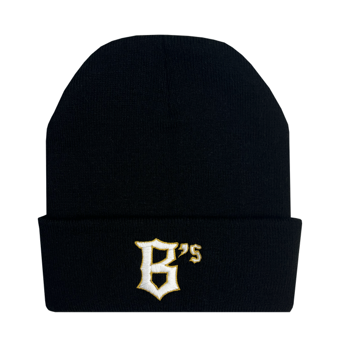 The Oakland Ballers Logo Beanie is a black beanie hat with a folded brim that features the embroidered logo of the professional baseball team, Oakland Ballers. The logo consists of a stylized white and yellow letter "B" followed by small letters "'s." The hat has an otherwise plain design except for the logo on the brim.