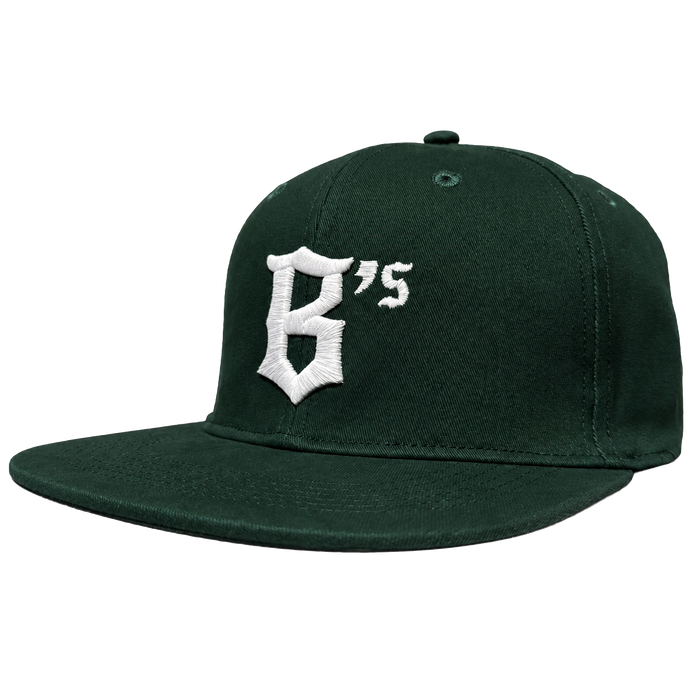 The Oakland Ballers Logo Hat by Oakland Ballers is a dark green snapback with a flat brim, featuring a white embroidered "B’s" logo on the front, inspired by the Pioneer League baseball team. Eyelets on top provide ventilation.