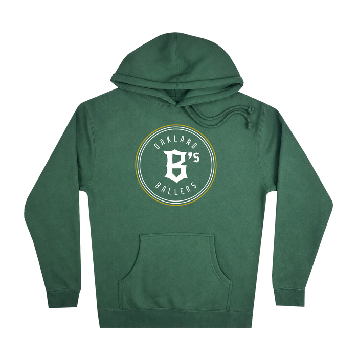 The Oakland Ballers Logo Heavyweight Hoodie by Oakland Ballers is a green sweatshirt featuring a large white "B" in a circular logo and "Oakland B’s Ballers" printed on the chest to celebrate the Oakland Ballers pro baseball team. This hoodie includes a front pocket, a drawstring hood, and is displayed against a plain white background.