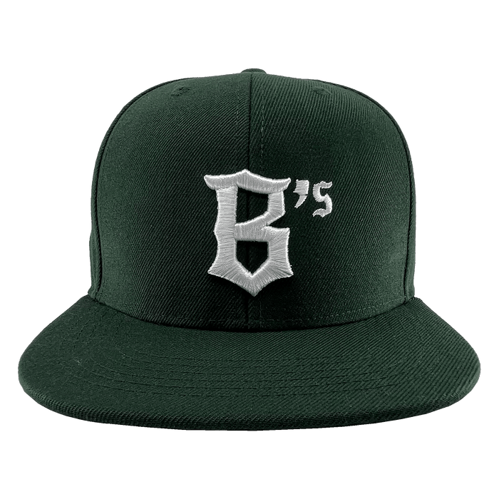 An Oakland Ballers Snapback in dark green with a flat-brim design, featuring a white embroidered logo that showcases a stylized "B" followed by an apostrophe and the number 5, forming "B's". Perfect for showing support for your favorite professional baseball team, the Oakland Ballers. The cap is displayed against a white background.