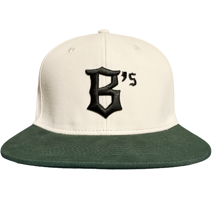 Introducing the Oakland Peloteros Hat by Oakland Ballers—a cream-colored baseball cap with a dark green brim, inspired by the Oakland Ballers from the Pioneer League. The front displays a bold black "B's" in gothic font, capturing the vibrant spirit of Oakland’s newest baseball team. Set against a plain white background.