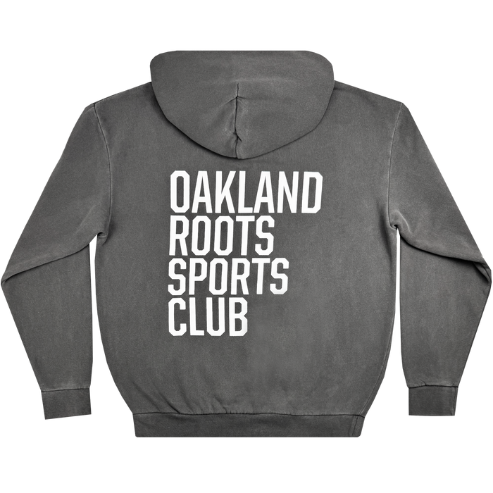 The Oakland Roots SC Heavy Hoodie from Oakland Roots SC features a hood and displays large white text reading "OAKLAND ROOTS SPORTS CLUB" vertically across the back. This long-sleeved, relaxed-fit hoodie celebrates social good and community spirit.