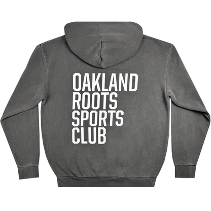 The Oakland Roots SC Heavy Hoodie from Oakland Roots SC features a hood and displays large white text reading "OAKLAND ROOTS SPORTS CLUB" vertically across the back. This long-sleeved, relaxed-fit hoodie celebrates social good and community spirit.