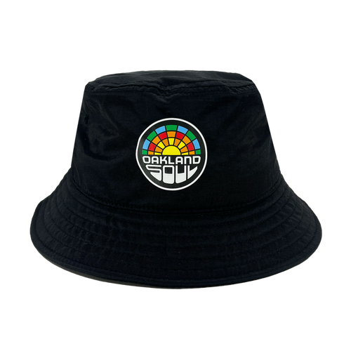 Check out the Oakland Soul Logo Bucket Hat, a stylish black bucket hat adorned with the Oakland Soul logo on the front. The vibrant, multi-colored semicircle evokes a rainbow, with "OAKLAND" displayed prominently in bold white letters and "SOUL" in smaller white letters beneath it. Show your support for this inspiring women's soccer team in the USL W-League!