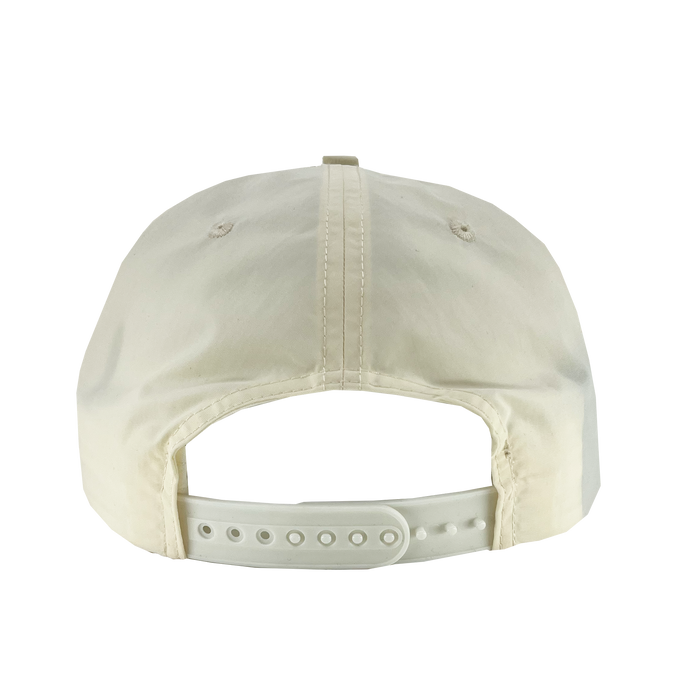 The Oakland Soul Surf Cap, a light beige baseball cap, is shown from the back revealing its adjustable white strap with multiple holes for size customization. The cap's fabric has a smooth texture and features visible stitching along the center and sides. Adorned with the Oakland Soul women's soccer team logo, it's an ideal accessory for USL W-League fans.