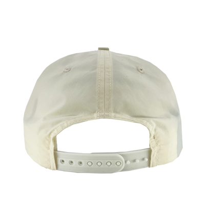 The Oakland Soul Surf Cap, a light beige baseball cap, is shown from the back revealing its adjustable white strap with multiple holes for size customization. The cap's fabric has a smooth texture and features visible stitching along the center and sides. Adorned with the Oakland Soul women's soccer team logo, it's an ideal accessory for USL W-League fans.