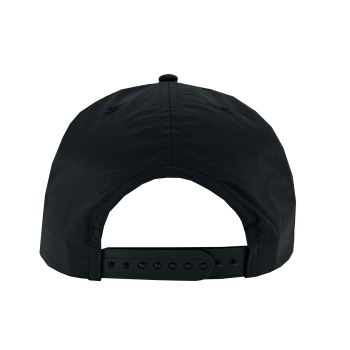 The image displays the back view of the Oakland Soul Surf Cap, a black baseball cap ideal for fans of the USL W-League's Oakland Soul women's soccer team. This cap, from the Oakland Soul brand, features a classic snapback closure with small holes and a plastic strap for adjustable fitting. The top part of the cap is adorned with visible stitching and a small fabric button.