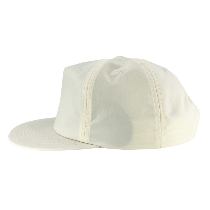 A side view of the Oakland Soul Surf Cap, featuring a plain beige design. The cap has a flat brim, six panels with matching beige stitching, and two ventilation holes on the topmost panel. The Oakland Soul USL W-League women's soccer team logo is subtly embroidered on the front. It is displayed against a white background.