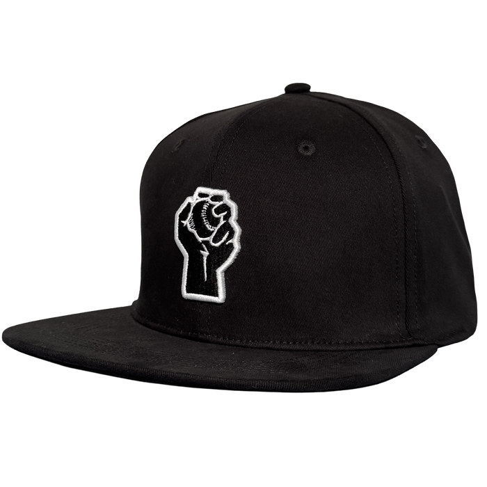 The Oakland Stand Up Hat by Oakland Ballers is a black snapback with a flat brim, featuring an embroidered white outline of a raised fist holding a baseball on the front panel—an homage to the team.