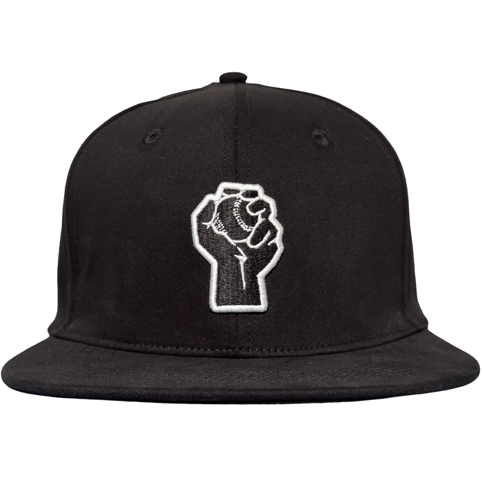 The Oakland Stand Up Hat by Oakland Ballers is a black flat-bill cap with an embroidered white raised fist on the front, symbolizing solidarity and resistance—a bold tribute to the team from the Pioneer League.