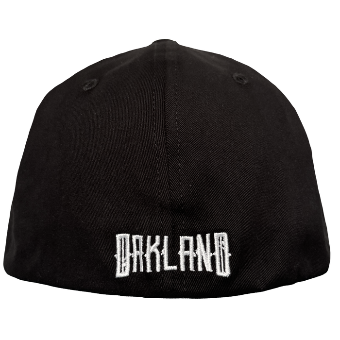 The Oakland Ballers’ Oakland Stand Up Hat is a black cap with "OAKLAND" boldly embroidered in white on the back, shown against a plain white background—a stylish tribute to the team and their Pioneer League spirit.