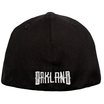 The Oakland Ballers’ Oakland Stand Up Hat is a black cap with "OAKLAND" boldly embroidered in white on the back, shown against a plain white background—a stylish tribute to the team and their Pioneer League spirit.