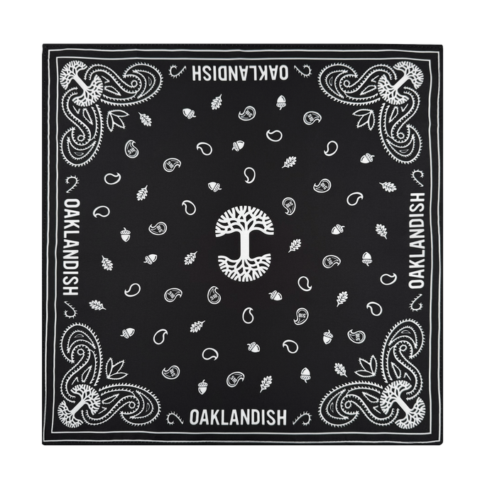 The Oaklandish Bandana by Oaklandish is a black and white polyester accessory featuring a central white tree, acorns, leaves, paisley details, and bold "OAKLANDISH" text along the edges—a stylish standout piece.