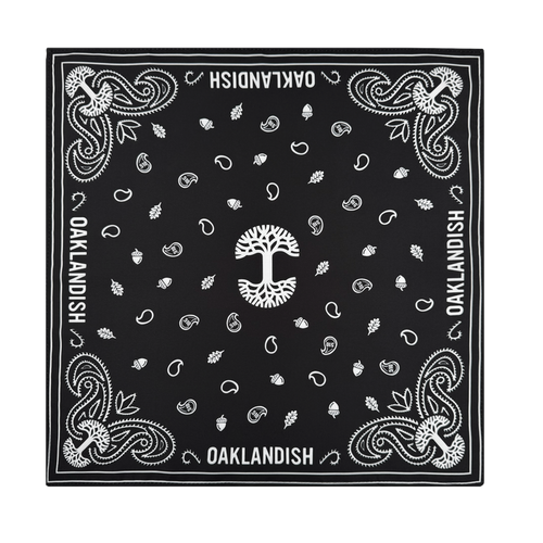 The Oaklandish Bandana by Oaklandish is a black and white polyester accessory featuring a central white tree, acorns, leaves, paisley details, and bold "OAKLANDISH" text along the edges—a stylish standout piece.