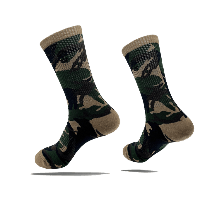 Side view of camo crew socks with a small black Oaklandish tree logo on the side calves.