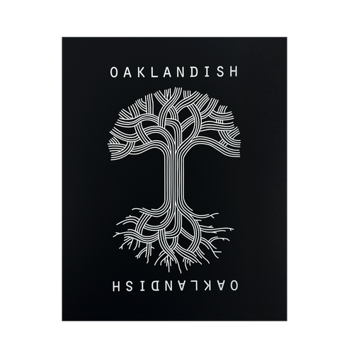 A symmetrical tree with branched lines forming roots and branches is centered against a black background in the Oaklandish Classic Logo Print by Never Elsewhere. The white text "OAKLANDISH" appears above and below the tree, with the lower text inverted. The design has a modern, graphical look reminiscent of a letterpress print, creating a striking contrast.