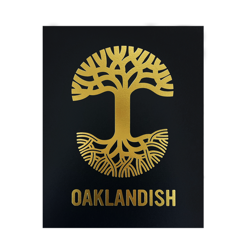 The Oaklandish New Logo Print by Never Elsewhere showcases a gold emblem of a stylized tree with branches extending upwards and roots spreading downwards against a black background. Below the tree, the word "OAKLANDISH" is also rendered in gold, complementing the emblem. The design has a symmetrical and minimalist aesthetic reminiscent of a letterpress print.